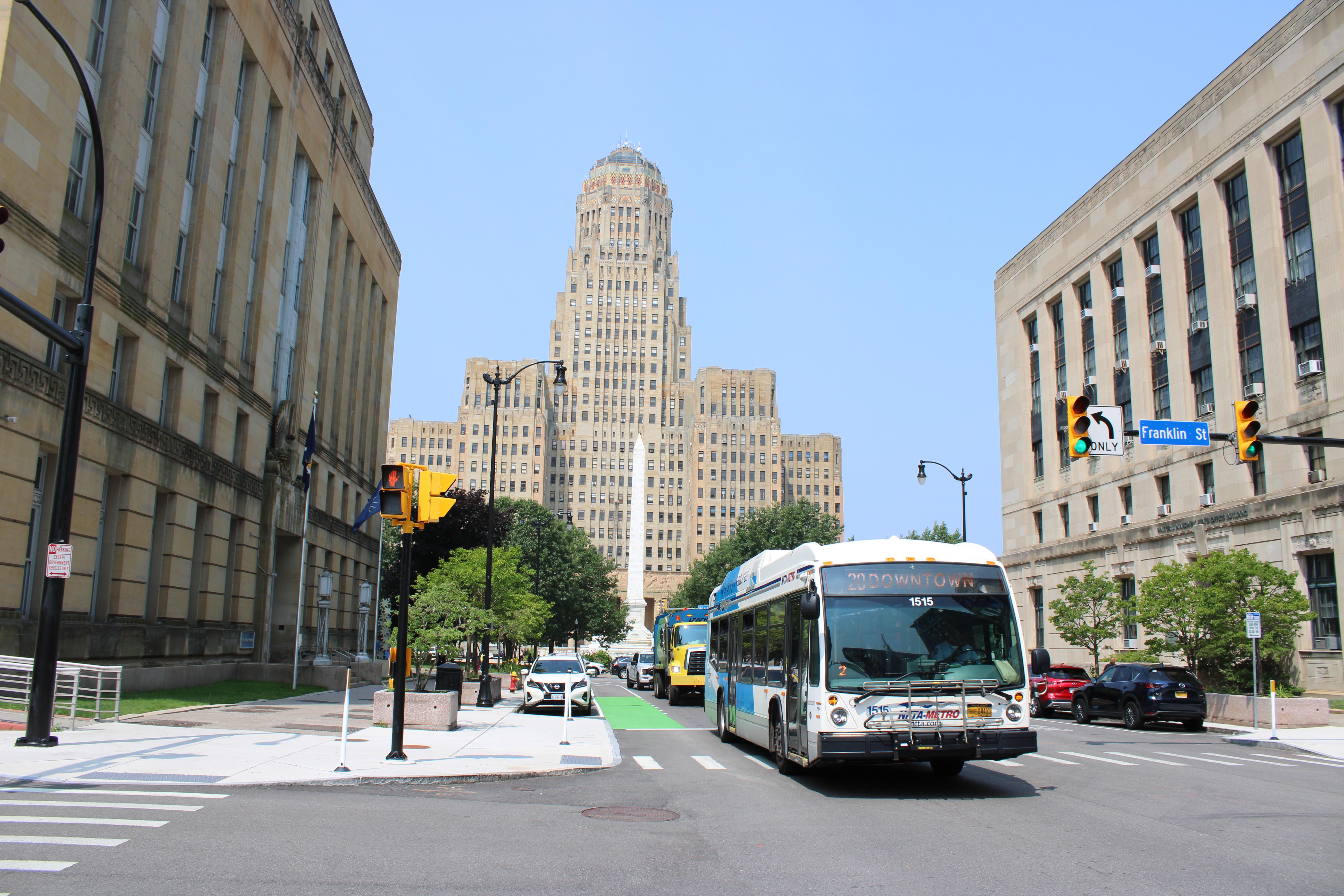 Buffalo City Hall in background and NFTA Bus.