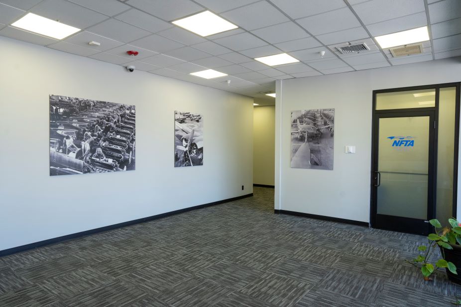 Photo of front entrance of 485 Cayuga with pictures and the door of the property office