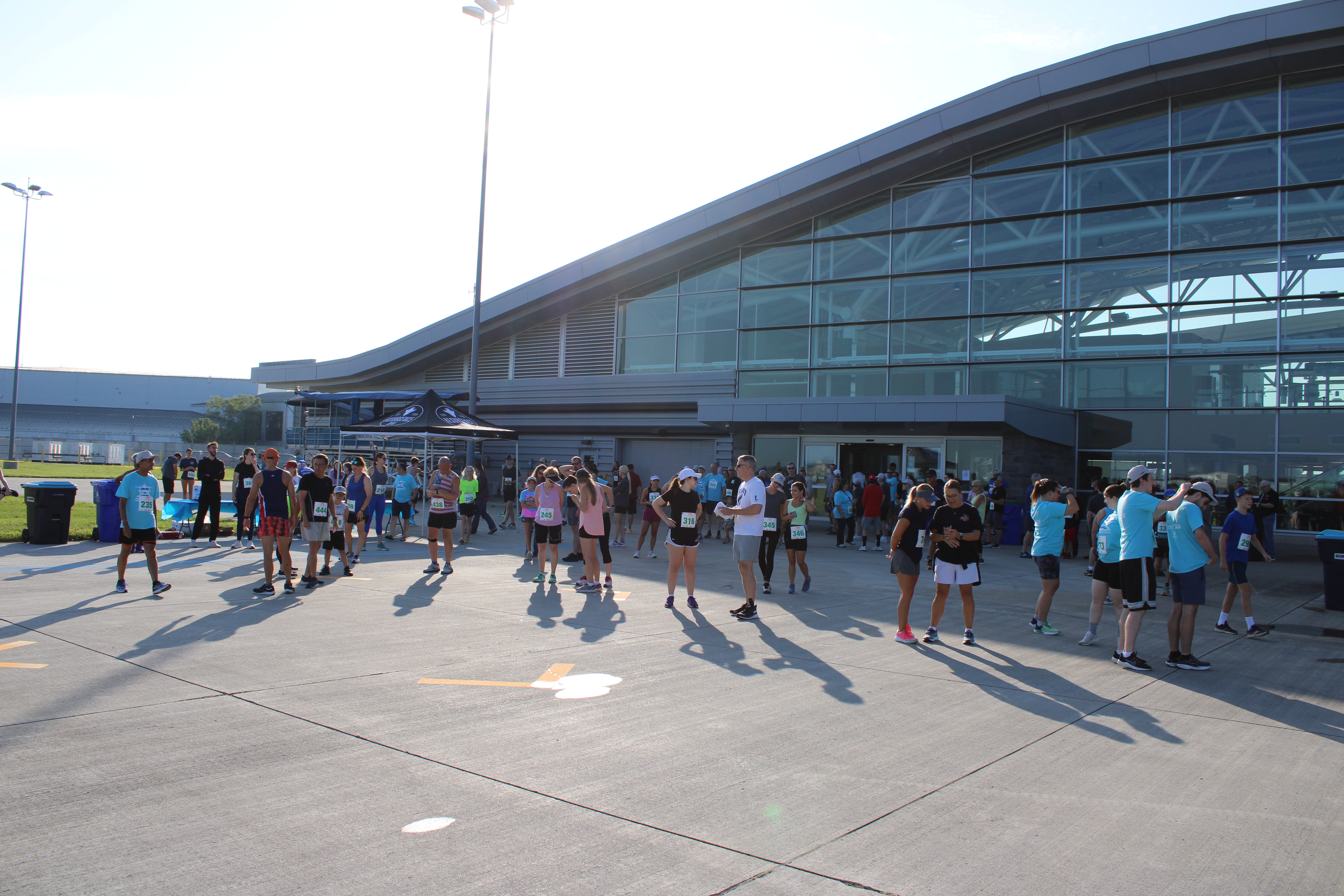 NFTA leaders, employees, and community members lace up to hit the tarmac