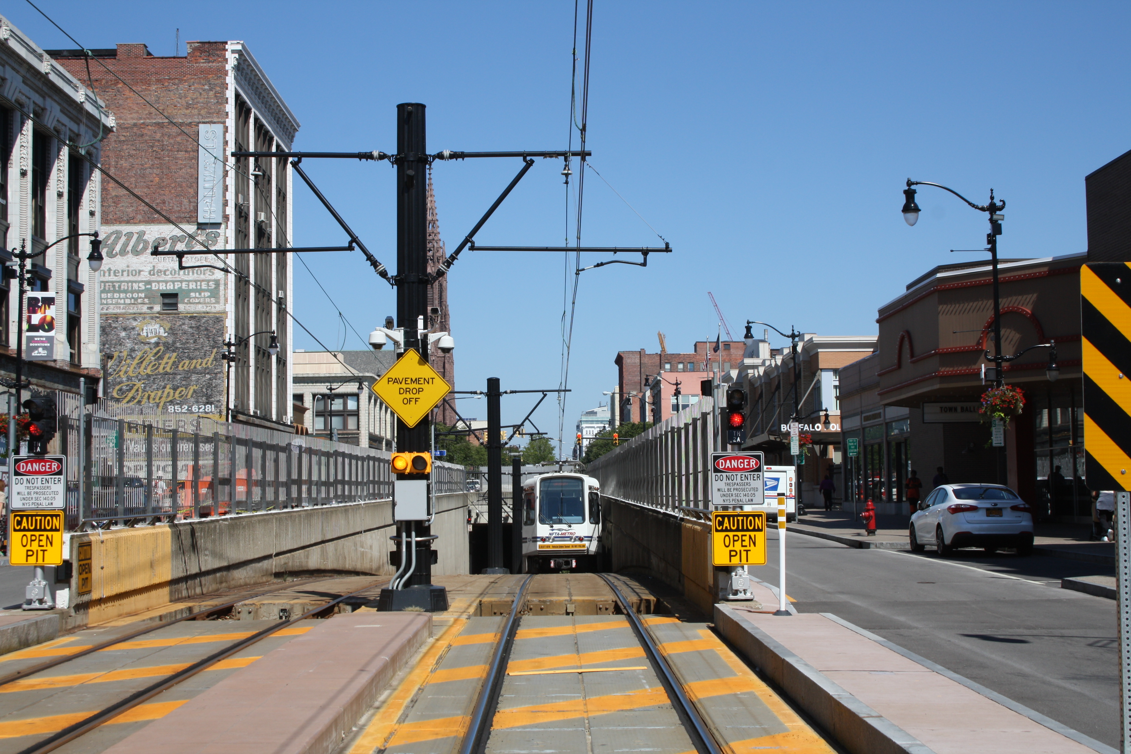 Metro rail cars coming out of tunnel