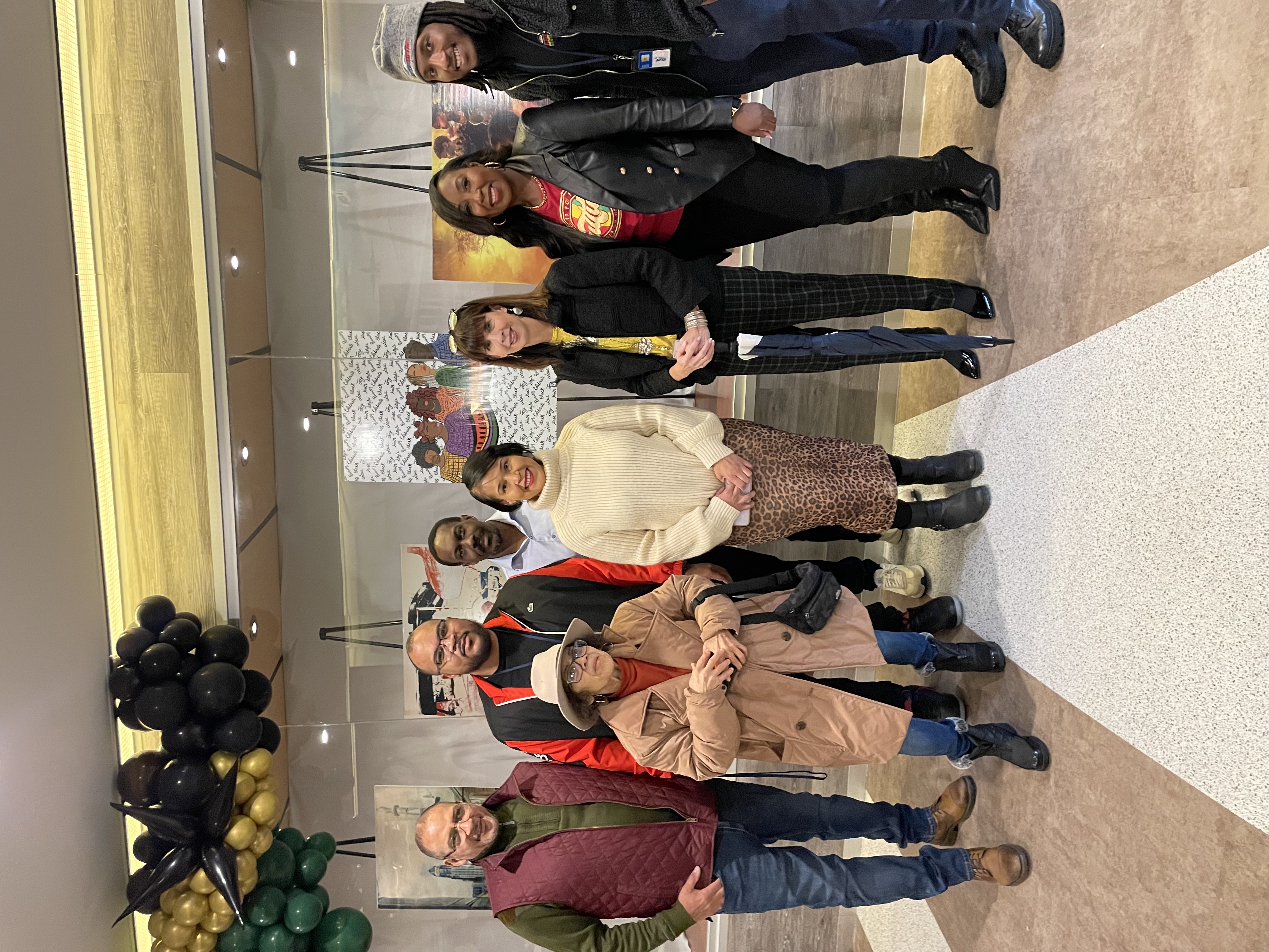 Runner up Corrie Allen with NFTA  CEO Kim Minkel, Director of Transit James Morrell,l and members of the African American Heritage Committee 